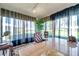 Well-lit home office with a large desk, comfortable chair, and scenic outdoor views at 6524 11Th W Ave # 5611, Bradenton, FL 34209