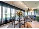 Bright sunroom features a glass dining table, comfortable seating, and large windows with views at 6524 11Th W Ave # 5611, Bradenton, FL 34209