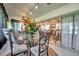 Inviting sunroom showcasing a dining area, sliding glass doors, and stylish chaise lounge at 6524 11Th W Ave # 5611, Bradenton, FL 34209