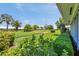 Lush green community lawn with mature landscaping, perfect for relaxation and recreation at 6524 11Th W Ave # 5611, Bradenton, FL 34209