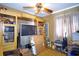 Bedroom featuring built-in shelving and a ceiling fan at 6812 E 21St Ave, Tampa, FL 33619