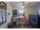 Cozy dining area featuring a small table, chairs, and natural light from the window at 6812 E 21St Ave, Tampa, FL 33619
