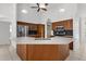 Well-lit kitchen featuring stainless steel appliances, modern cabinets, and open layout at 710 N River Rd, Venice, FL 34293