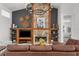 Elegant living room with stone fireplace, sophisticated decor, and inviting atmosphere at 710 N River Rd, Venice, FL 34293
