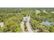 Aerial view of the community entrance featuring lush trees and manicured landscaping at 7303 Westminster Ct, University Park, FL 34201