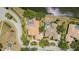 An aerial view highlighting the home's roof, landscaping, and surrounding neighborhood at 7303 Westminster Ct, University Park, FL 34201