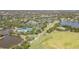 Aerial view showcases the community's golf course and water features at 7303 Westminster Ct, University Park, FL 34201