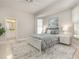 Inviting bedroom featuring a large bed, soft neutral tones, and plenty of natural light at 7303 Westminster Ct, University Park, FL 34201