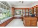 Bright office space with custom built-in shelving, desk and large picture window overlooking the lake at 7303 Westminster Ct, University Park, FL 34201