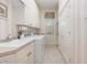 A functional laundry room offers ample storage, a sink, and modern appliances at 7303 Westminster Ct, University Park, FL 34201