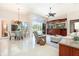 Spacious living room boasts elegant tile flooring, natural light, and a seamless connection to the outdoor pool area at 7303 Westminster Ct, University Park, FL 34201