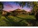 Screened-in patio provides shaded area perfect for relaxing in the manicured backyard at 7519 Berna Ln, Land O Lakes, FL 34637