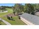 Exterior of home with a view of the golf course and mature trees at 7519 Berna Ln, Land O Lakes, FL 34637