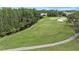 Aerial view of the pristine golf course and surrounding greenery at 7519 Berna Ln, Land O Lakes, FL 34637