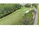 Beautiful aerial view of the landscaped golf course and neighboring community at 7519 Berna Ln, Land O Lakes, FL 34637