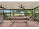 Outdoor patio with brick flooring and a hammock boasts views of the scenic golf course at 7519 Berna Ln, Land O Lakes, FL 34637