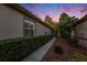 Side yard features a concrete path, well-maintained landscaping, and mature trees, creating a serene outdoor space at 7519 Berna Ln, Land O Lakes, FL 34637