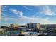 Beautiful aerial view of buildings, tennis courts, pool and palm trees under a cloudy blue sky at 7700 Sun Island S Dr # 506, South Pasadena, FL 33707