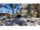 Building common area with white benches, tables and a grill at 7700 Sun Island S Dr # 506, South Pasadena, FL 33707