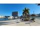 Community area showcasing grills, picnic tables under tiki huts, and a marina with boats docked at 7700 Sun Island S Dr # 506, South Pasadena, FL 33707