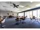 Community room with tables, chairs, and a large window offering natural light and a welcoming space at 7700 Sun Island S Dr # 506, South Pasadena, FL 33707