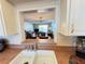 Kitchen view offering a glimpse into the living area with comfortable furnishings and plenty of light at 7700 Sun Island S Dr # 506, South Pasadena, FL 33707