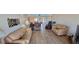 Spacious living room showcasing an open-concept design, tile floors and seamless transitions to other spaces at 7700 Sun Island S Dr # 506, South Pasadena, FL 33707