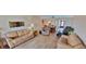 Bright living room featuring comfortable furnishings and an open layout for easy access to other rooms at 7700 Sun Island S Dr # 506, South Pasadena, FL 33707