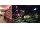 Hallway shot with colorful lights and a beautiful night view of the city at 7700 Sun Island S Dr # 506, South Pasadena, FL 33707