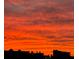 Vibrant sunset with layered clouds painting the sky in stunning reds and oranges at 7700 Sun Island S Dr # 506, South Pasadena, FL 33707