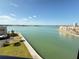 Scenic view of a blue water canal with neighborhood condos in the background at 7700 Sun Island S Dr # 506, South Pasadena, FL 33707