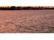 Sunset colors on the open water create a serene and tranquil atmosphere at 7700 Sun Island S Dr # 506, South Pasadena, FL 33707