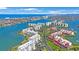 Aerial view features waterfront condos with stunning water views and access to nearby amenities at 7872 Sailboat Key S Blvd # 602, South Pasadena, FL 33707