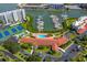 Aerial view of the community featuring a pool, tennis courts, marina, and waterfront condos at 7872 Sailboat Key S Blvd # 602, South Pasadena, FL 33707