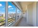 Enclosed balcony with tile floor and expansive views of the surrounding area and landscaping at 7872 Sailboat Key S Blvd # 602, South Pasadena, FL 33707