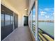 Enclosed balcony offers water views with tiled floor and screen doors for easy access at 7872 Sailboat Key S Blvd # 602, South Pasadena, FL 33707