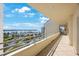 Large balcony with views of the waterway, palm trees, and clear blue skies at 7872 Sailboat Key S Blvd # 602, South Pasadena, FL 33707