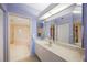 Bathroom featuring double doors and vanity with ample counter space and storage at 7872 Sailboat Key S Blvd # 602, South Pasadena, FL 33707
