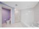 Bright bathroom featuring a glass shower, soaking tub, and toilet area at 7872 Sailboat Key S Blvd # 602, South Pasadena, FL 33707
