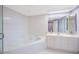 Large bathroom featuring a bathtub, a shower and a sink with a large mirror at 7872 Sailboat Key S Blvd # 602, South Pasadena, FL 33707