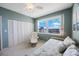 Cozy bedroom with large window view, spacious closet, and a ceiling fan at 7872 Sailboat Key S Blvd # 602, South Pasadena, FL 33707