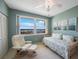 Peaceful bedroom features bright natural light, comfortable seating, and scenic artwork at 7872 Sailboat Key S Blvd # 602, South Pasadena, FL 33707
