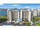 Multi-story condominium building boasting beautiful architecture, well-manicured landscaping, and convenient parking at 7872 Sailboat Key S Blvd # 602, South Pasadena, FL 33707