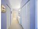 Hallway leading to a bathroom with double closets for extra storage at 7872 Sailboat Key S Blvd # 602, South Pasadena, FL 33707