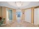 Hallway with tile flooring leading to a water view with decorative lighting and neutral paint at 7872 Sailboat Key S Blvd # 602, South Pasadena, FL 33707