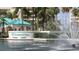 Harbour Side entrance with fountain and lush landscaping, providing a welcoming arrival experience at 7872 Sailboat Key S Blvd # 602, South Pasadena, FL 33707