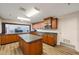 Well-equipped community kitchen with ample counter space, built-in microwave, and wood cabinets at 7872 Sailboat Key S Blvd # 602, South Pasadena, FL 33707