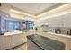 Well-lit kitchen featuring bright countertops, sleek appliances, and scenic exterior views at 7872 Sailboat Key S Blvd # 602, South Pasadena, FL 33707