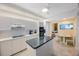 Modern kitchen featuring white cabinetry, granite countertops, and stainless steel appliances at 7872 Sailboat Key S Blvd # 602, South Pasadena, FL 33707