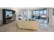 Open-concept living room featuring large windows, a nice couch and furnishings at 7872 Sailboat Key S Blvd # 602, South Pasadena, FL 33707